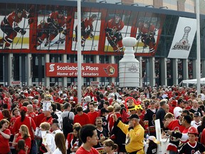 Jubilant hockey fans take part in the festivities  prior to the Senators face-off against the Anaheim Ducks in game three of the Stanley Cup finals, June 2, 2007.