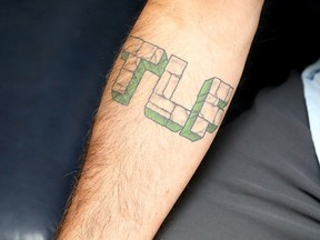 Keith Egli notes his tattoo is reminiscent of the lettering on Incredible Hulk comics.