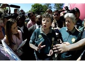 AUGUSTA, GA - APRIL 12:  Martha Burk, Chairwoman of the National Council of Women's Organizations, and Eleanor Smeal, the Feminist Majority Foundation President, talk with the media during Masters week demonstrations on Washington Road outside the gates of Augusta National on April 12, 2003 in Augusta, Georgia.