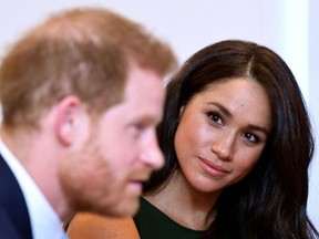 In this file photo taken on October 15, 2019 Britain's Prince Harry, Duke of Sussex, and Britain's Meghan, Duchess of Sussex attend the annual WellChild Awards in London on October 15, 2019.