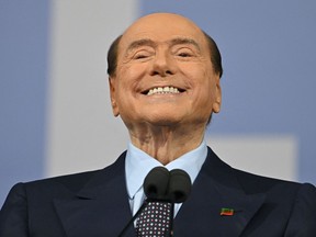 (FILES) In this file photo taken on September 22, 2022 Forza Italia leader Silvio Berlusconi speaks on stage on September 22, 2022 during a joint rally of Italy's right-wing parties Brothers of Italy (Fratelli d'Italia, FdI), the League (Lega) and Forza Italia at Piazza del Popolo in Rome, ahead of the September 25 general election. - Former Italian Prime Minister Silvio Berlusconi was in intensive care on April 5, 2023 for heart problems, a member of his entourage told AFP. (Photo by Alberto PIZZOLI / AFP)