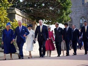 Britain's King Charles III (2L) and Britain's Camilla, Queen Consort (L) walk with Britain's Princess Anne, Princess Royal (3L), Britain's Prince Andrew, Duke of York (4L), Britain's Sophie, Duchess of Edinburgh (centre left) and Britain's Prince Edward, Duke of Edinburgh (4R), Britain's James, Earl of Wessex and Vice Admiral Timothy Laurence (R) as they arrive for the Easter Mattins Service at St. George's Chapel, Windsor Castle on April 9, 2023.