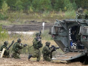 Canadian soldiers participate in NATO military exercises at a training ground in Kadaga, Latvia, in 2021.