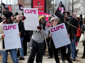Carleton University teaching assistants and contract instructors picketed at the Bronson Street entrance to the university Monday, March 27, 2023. Carleton students have only three classroom days remaining before the exam period begins.