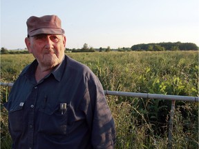 Frank Meyers stands in a field of his family's farm in Quinte West in June 2009, about two years after federal officials first began trying to acquire land north of CFB Trenton. Meyers, who died Sept. 15, 2019 in Trenton, spent years fighting federal expropriation of his family's farm.