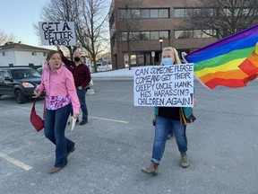 Protesters clash in the parking lot of the Ottawa-Carleton District School Board on March 28, 2023.