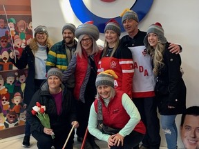 A group of "Rockheads" pose at the 2023 world men's curling championship in Ottawa.