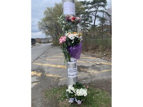 A memorial is seen at Richmond Road and Kirkwood Avenue.