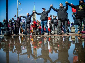 A group of an estimated 100-200 protesters joined together on Wellington Street, near Parliament Hill, as part of #NationalShutdown activities on Saturday.