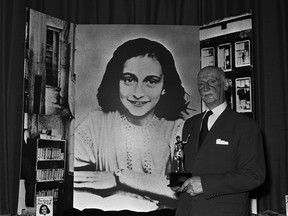 FILE - Dr. Otto Frank holds the Golden Pan award, given for the sale of one million copies of the famous paperback, "The Diary of Anne Frank". A high school along Florida's Atlantic Coast has removed a graphic novel based on the diary of Anne Frank after a leader of a conservative group challenged it, claiming it minimized the Holocaust. "Anne Frank's Diary: The Graphic Adaptation" was removed from a library at Vero Beach High School after a leader of Moms for Liberty in Indian River County raised an objection.