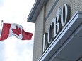 A Canadian flag flies near an under construction LCBO store in Bowmanville, Ont. on Saturday July 20, 2013.The Liquor Control Board of Ontario says it will phase out paper bags at its retail stores, a move the provincial agency says will save the equivalent of 188,000 trees each year. THE&ampnbsp;CANADIAN PRESS/Doug Ives