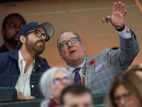 File photo/ Ryan Reynolds, the Vancouver actor who's considered a frontrunner in the field of prospective team buyers, speaks to Anthony LeBlanc, the Senators' president of business operations.