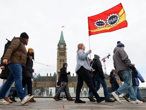Hundreds of public servants march at Parliament Hill on April 19, 2023.