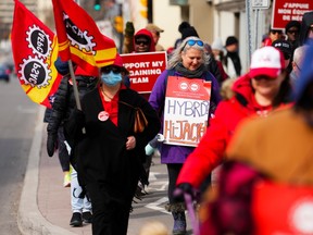PSAC workers and supporters picket in front of Treasury Board President Mona Fortier's office in Ottawa on  April 21.