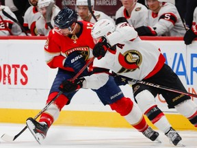 Florida Panthers centre Eric Staal (12) and Ottawa Senators right wing Claude Giroux (28) vie for the puck during the second period of an NHL hockey game Thursday, April 6, 2023, in Sunrise, Fla.