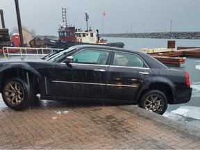 Woman charged with impaired driving after car backed up, dangling over Prescott pier.