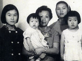 A young Talia Chung is shown in the arms of her mother, Lin Lew, along with sisters (left to right) Anna, Fong, and Lucy.
