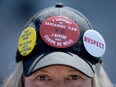 PSAC striker with badges on hat