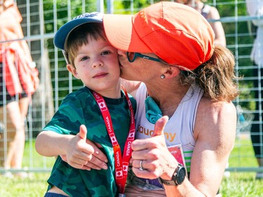 Malindi Elmore, top Canadian female to finish the marathon and second female over all, gives her son