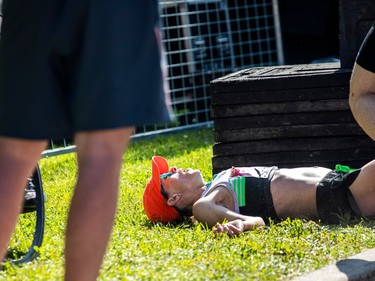 Malindi Elmore, top Canadian female to finish the marathon and second female over all lay in the grass moments after crossing the finish line