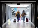 Passengers enter Ottawa's Macdonald-Cartier International Airport. They'll still have to take all the electronics out of their carry-on bags.