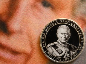 LONDON, ENGLAND - APRIL 29: In this photo illustration, a souvenir collectible coin marking the Coronation of King Charles III is seen on April 29, 2023 in London, England. The Coronation of King Charles III and The Queen Consort will take place on May 6, part of a three-day celebration.