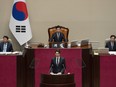 Speaker of the National Assembly Kim Jin-pyo looks on as Prime Minister Justin Trudeau speaks to the National Assembly in Seoul, South Korea, Wednesday, May 17, 2023.