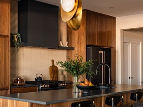 The asymmetrical kitchen of the Piper I oozes warmth and the unexpected, such as the single offset pendant over the island.