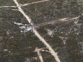 This image supplied by the Department of Fire and Emergency Services of Western Australia, shows the wreckage of a Boeing 737-3 with two people on board that went down over the Fitzgerald River National Park, in Western Australia, Monday, Feb 6, 2023. The water bomber crashed in the forest between Ravensthorpe and Hopetoun.