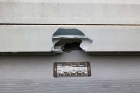 Closeup of gunshot hole visible in Bellefeuille’s home.