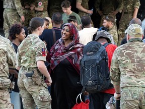 British soldiers and the last evacuees board an RAF aircraft during the final days of evacuations, at Wadi Seidna Air Base, in Sudan April 29, 2023. "Canada has been playing it exceptionally safe" with its evacuations in Sudan, one military expert says.