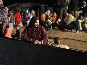 Sudanese evacuees wait to board a Saudi ship at Port Sudan, May 3, 2023.