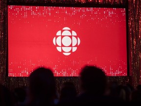 The CBC logo is projected onto a screen.