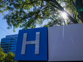 A new plan to force hospitals to report adverse effects of "natural health products" such as herbal remedies and supplements has come as a surprise to manufacturers, who say they are blindsided by the proposed change. An entrance sign to a hospital is shown in Toronto on Tuesday, October 19, 2021.