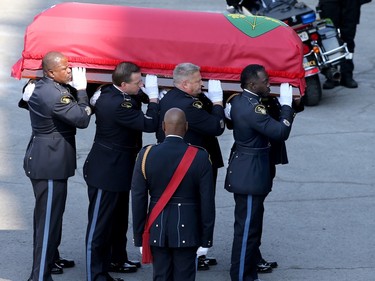 The casket carrying Sgt. Eric Mueller is carried by pallbearers into his funeral at the Canadian Tire Centre in Ottawa Thursday morning.
The police officer was killed when responding to a call in Bourget in the early-morning hours of May 11th, along with two other officers who were wounded at the same time.