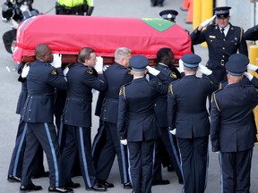OTTAWA. MAY 18, 2023. The casket carrying Sgt. Eric Mueller is carried by pallbearers into his funeral at the Canadian Tire Centre in Ottawa Thursday morning.
The police officer was killed when responding to a call in Bourget in the early-morning hours of May 11th, along with two other officers who were wounded at the same time. 
The funeral procession, which travelled from Rockland to Kanata, was expected to have about 9,000 police in attendance.