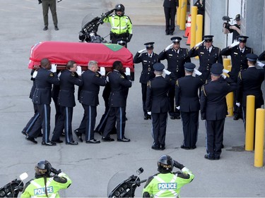 The casket carrying Sgt. Eric Mueller is carried by pallbearers into his funeral at the Canadian Tire Centre in Ottawa Thursday morning.
The police officer was killed when responding to a call in Bourget in the early-morning hours of May 11th, along with two other officers who were wounded at the same time.  The funeral procession, which travelled from Rockland to Kanata, was expected to have about 9,000 police in attendance.