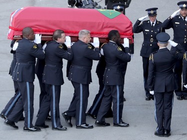 Thousands of officers march ahead of the hearse carrying Sgt. Eric Mueller to his funeral at the Canadian Tire Centre in Ottawa Thursday morning. The police officer was killed when responding to a call in Bourget in the early-morning hours of May 11th, along with two other officers who were wounded at the same time.  The funeral procession, which travelled from Rockland to Kanata, was expected to have about 9,000 police in attendance.