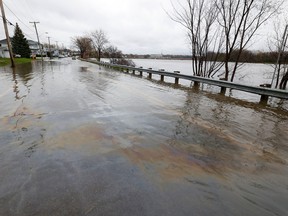 Dozens of streets were closed near Rue Saint-Louis in Gatineau due to flooding Wednesday. Gas can be seen in the water.