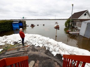 OTTAWA - May 4, 2023 -  Dan Larrivee looks out to the rising waters of the Ottawa River behind his Leo Lane House in Cumberland Thursday.