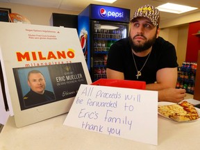 Michael Paoletti stands behind his counter at Milano Pizza in Bourget on Friday afternoon. Paoletti and his staff are raising money to go to OPP Sgt. Eric Mueller's family after he was killed in the community Thursday.