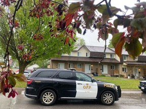 Ontario Provincial Police outside a residence in Renfrew, which was the scene of a homicide on Saturday, May 20, 2023.