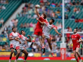 Canada captain Phil Berna (red No. 4) climbs high at a lineout against Tonga on Day 2 of the HSBC London Sevens at Twickenham Stadium in London on Sunday, May 21, 2023.