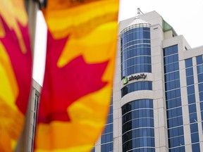 A class-action lawsuit alleges Shopify Inc. reneged on a deal it offered employees laid off in a recent round of cuts. Shopify Inc. headquarters are located in Ottawa.