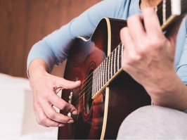 Guitar playing woman