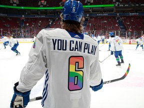 Brock Boeser of the Vancouver Canucks warms up in his You can play Pride night jersey