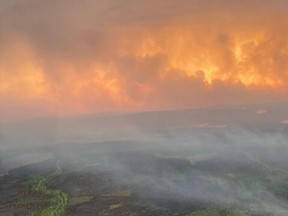 This handout image courtesy of helicopter pilot Kevin Burton shows an aerial view of wildfires between Chibougamau and the Mistissini Indigenous community in northern Quebec on June 5, 2023.