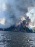 Huge smoke cloud above out-of-control fire on Centennial Lake.