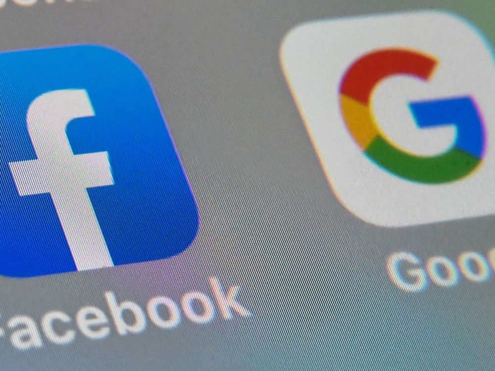 Logos of mobile apps Facebook and Google displayed on a tablet.