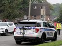 Ottawa police maintain a presence around the 1500 block of Caldwell Avenue on Friday morning. It was the scene of another homicide Thursday evening, the second in the last two days in the Carlington area.